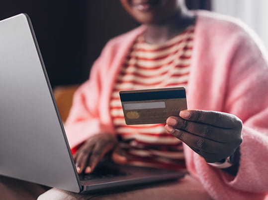 woman online shopping with credit card