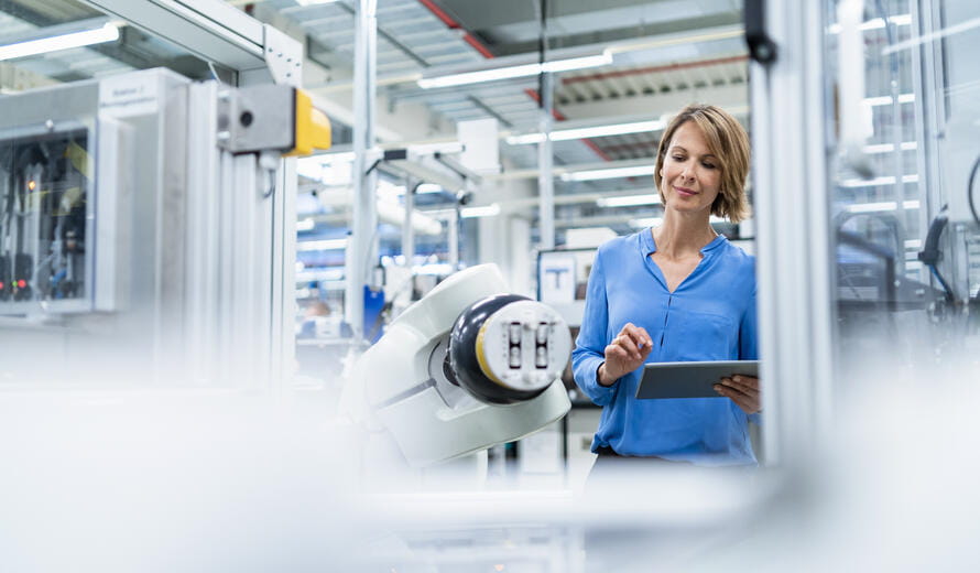 woman in manufacturing on a tablet