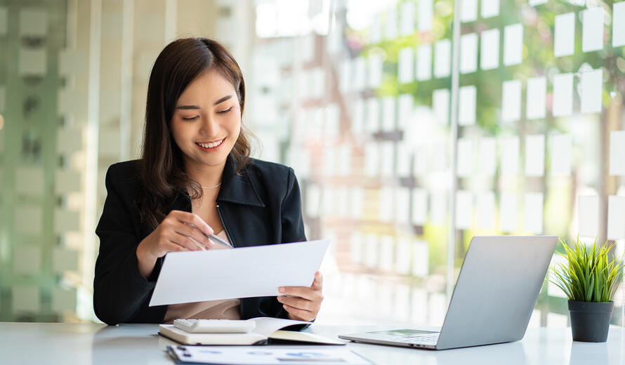 woman reading a paper