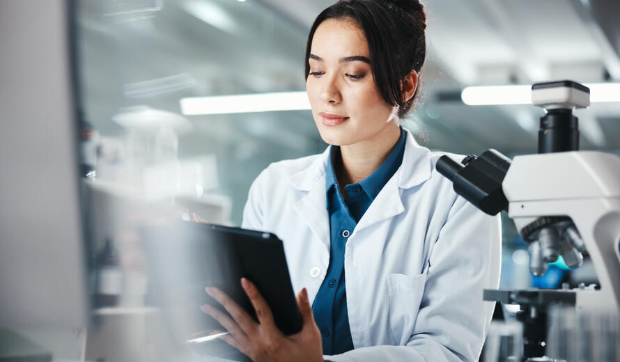 healthcare worker on a tablet