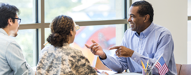 Banker and clients meeting at a table