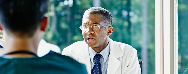 man with glasses talking